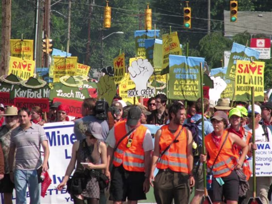 Hundreds of marchers head out Monday, June 6, 2011, on a five-day, 50-mile trek through West Virginia’s southern coalfields in an effort to draw attention to mining threats to Blair Mountain. The mountain is the site of a 1921 armed uprising where between 7,500 and 10,000 coal miners marched for better working and living conditions in the mines. The uprising was the largest since the Civil War and was ultimately put down after federal troops were called in. (AP Photo/Brian Farkas)